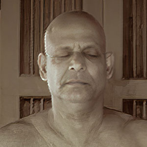 Sivananda meditating indoors