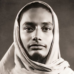 early portrait of Swami Venkatesananda, the young monk, wearing a shawl