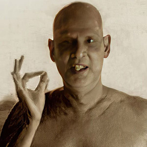 Monks along with Swami Venkatesananda are standing and sitting near to Swami Sivananda