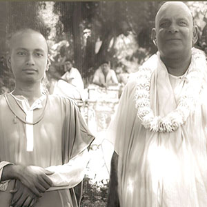 Swami Venkatesananda and Master Sivananda posing for the camera. 