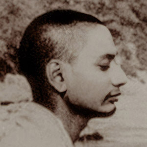 Young Swami Venkatesananda meditating at the riverbank. 