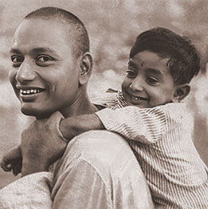  Young Swami Venkatesananda giving a piggy-back ride to a young boy. 