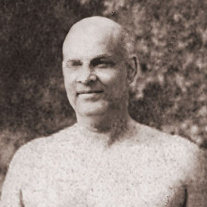 Sivananda and swamis dressed only in loin cloths,standing ready for Hatha and Pranayama practices. 