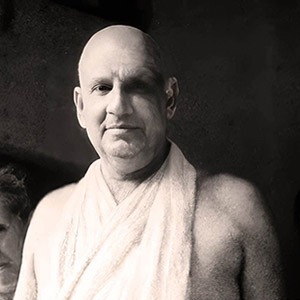 Disciples standing behind Swami Sivananda  include Swami Hridayananda, Swami Venkatesananda and Swami Vishnu-devananda